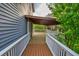 Spacious deck with wood flooring and white railings overlooking backyard at 1647 Grandeus Sw Ln, Stone Mountain, GA 30087