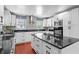 Modern kitchen featuring stainless steel appliances, granite countertops, and a functional center island at 1647 Grandeus Sw Ln, Stone Mountain, GA 30087
