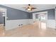 Bright living room with travertine floors, white wainscoting, and views into the dining area at 1647 Grandeus Sw Ln, Stone Mountain, GA 30087
