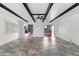 Open-concept living room featuring beamed ceilings, hardwood floors and lots of natural light at 1647 Grandeus Sw Ln, Stone Mountain, GA 30087