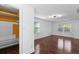 Large bedroom with hardwood floors, closet with organizers, and windows for ample natural light at 1647 Grandeus Sw Ln, Stone Mountain, GA 30087