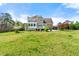 The home's spacious backyard has a well-maintained lawn, patio, and a lovely back porch ideal for relaxation at 2245 Friars Gate Dr, Lawrenceville, GA 30043