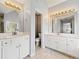Elegant bathroom with double vanity, granite countertops, and modern lighting fixtures at 2245 Friars Gate Dr, Lawrenceville, GA 30043