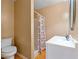 Neutral bathroom features a shower, toilet and vanity at 2245 Friars Gate Dr, Lawrenceville, GA 30043