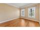 Inviting bedroom with hardwood floors, crown molding, and natural light at 2245 Friars Gate Dr, Lawrenceville, GA 30043