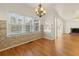 Bright breakfast nook with views, a chandelier, and access to the sunroom at 2245 Friars Gate Dr, Lawrenceville, GA 30043