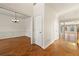 Spacious foyer with hardwood floors, chandelier and access to multiple rooms at 2245 Friars Gate Dr, Lawrenceville, GA 30043