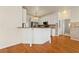 Kitchen with granite countertops and a breakfast bar open to the living area at 2245 Friars Gate Dr, Lawrenceville, GA 30043