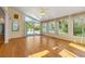 Bright sunroom featuring vaulted ceiling, and multiple windows offering picturesque views of the surrounding landscape at 2245 Friars Gate Dr, Lawrenceville, GA 30043