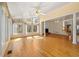 Spacious sunroom featuring ample natural light, with view of fireplace, stairs, and an open floor plan at 2245 Friars Gate Dr, Lawrenceville, GA 30043