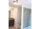 Modern bathroom with a glass-enclosed shower and granite countertops at 3324 Peachtree Ne Rd # 1010, Atlanta, GA 30326
