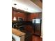 Well-equipped kitchen with granite counters, stainless steel appliances, and cherry wood cabinets for a modern design at 3324 Peachtree Ne Rd # 1010, Atlanta, GA 30326