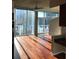 Spacious living area with hardwood floors, large windows and natural light, and a beautiful city view at 3324 Peachtree Ne Rd # 1010, Atlanta, GA 30326