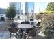 Outdoor dining area with tables, chairs, and mature shrubbery at 3324 Peachtree Ne Rd # 1010, Atlanta, GA 30326