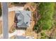 An aerial view showcasing the architectural details and a private deck, nestled among lush greenery at 4020 Balleycastle Ln, Duluth, GA 30097