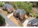 Aerial view of a brick home with a driveway and landscaped yard, highlighting the property's location and neighborhood at 4020 Balleycastle Ln, Duluth, GA 30097