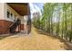 Spacious backyard with a staircase, patio, and wooded area, offering privacy and potential for outdoor activities at 4020 Balleycastle Ln, Duluth, GA 30097