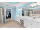 Beautifully appointed bathroom with double sinks, lots of counter space, and neutral colors at 4020 Balleycastle Ln, Duluth, GA 30097