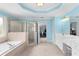 Large bathroom featuring double sinks, a glass shower, and a tub at 4020 Balleycastle Ln, Duluth, GA 30097