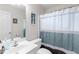 This full bathroom has a single vanity, a toilet, and a shower with bathtub combo at 4020 Balleycastle Ln, Duluth, GA 30097