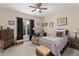 Comfortable bedroom with neutral walls, carpet and a ceiling fan at 4020 Balleycastle Ln, Duluth, GA 30097