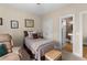 Cozy bedroom with neutral walls, carpet, leading to an ensuite bathroom at 4020 Balleycastle Ln, Duluth, GA 30097