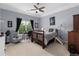 Spacious bedroom with a ceiling fan, carpet, and a window with views at 4020 Balleycastle Ln, Duluth, GA 30097