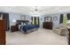 Spacious Primary bedroom featuring carpet, blue walls, and natural light from window at 4020 Balleycastle Ln, Duluth, GA 30097