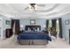 Spacious bedroom features a trey ceiling, cool paint color, and dark wood furnishings at 4020 Balleycastle Ln, Duluth, GA 30097