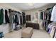 Walk-in closet with a window and racks and shelves on all walls at 4020 Balleycastle Ln, Duluth, GA 30097