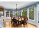 Bright dining area with hardwood floors, large windows, and an outdoor view at 4020 Balleycastle Ln, Duluth, GA 30097