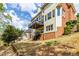 Exterior: multi-story home featuring a patio, a brick foundation, and a backyard at 4020 Balleycastle Ln, Duluth, GA 30097