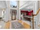 Inviting foyer featuring a decorative glass door, hardwood floors, and access to the dining room and staircase at 4020 Balleycastle Ln, Duluth, GA 30097