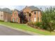 Eye-catching brick home with mature landscaping and shutters exudes traditional charm at 4020 Balleycastle Ln, Duluth, GA 30097