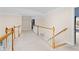 Upstairs hallway with carpet and bright natural light from windows at 4020 Balleycastle Ln, Duluth, GA 30097