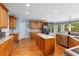 Eat-in kitchen features stainless steel appliances, custom cabinetry, and a backyard view at 4020 Balleycastle Ln, Duluth, GA 30097