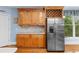 Kitchen features stainless steel refrigerator, custom cabinetry, and ample counter space at 4020 Balleycastle Ln, Duluth, GA 30097