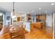 Open kitchen and living room layout is great for entertaining with hardwood floors and natural light at 4020 Balleycastle Ln, Duluth, GA 30097