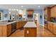 Open concept kitchen features stainless appliances and hardwood floors with natural light at 4020 Balleycastle Ln, Duluth, GA 30097