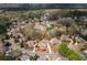 An aerial shot of a charming residential neighborhood surrounded by lush greenery and mature trees at 4020 Balleycastle Ln, Duluth, GA 30097