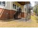 View of a walkout basement with a patio and staircase leading to the upper level, blending indoor-outdoor living at 4020 Balleycastle Ln, Duluth, GA 30097