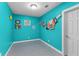 A small, bright blue room with art displayed on the walls at 4020 Balleycastle Ln, Duluth, GA 30097