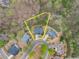 Aerial view of a home in a cul-de-sac with a large lot and mature trees at 5950 Bridge Stone Ct, Cumming, GA 30028