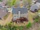 Spacious backyard featuring a wooden deck and ample green space with mature trees at 5950 Bridge Stone Ct, Cumming, GA 30028