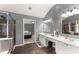Bright bathroom featuring double sinks and a soaking tub at 5950 Bridge Stone Ct, Cumming, GA 30028