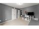 Bedroom with carpet, a closet, shelving, and a door leading to another room at 5950 Bridge Stone Ct, Cumming, GA 30028