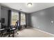 Bedroom with large windows providing natural light at 5950 Bridge Stone Ct, Cumming, GA 30028
