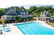 Community pool with lounge chairs and umbrellas, perfect for relaxation and recreation at 5950 Bridge Stone Ct, Cumming, GA 30028