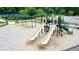 Image of the community playground set with swings and slides at 5950 Bridge Stone Ct, Cumming, GA 30028