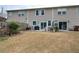 Exterior view of the home showcasing fenced backyard with a patio and landscaping potential at 338 Oak Leaf Pl, Acworth, GA 30102